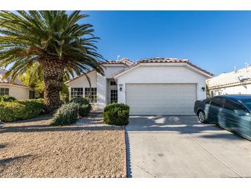 Single-story house with attached garage and desert landscaping at 4421 Rodman Dr, Las Vegas, NV 89130