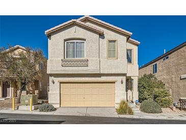 Two-story house with attached garage and landscaping at 9462 Diamond Bridge Ave, Las Vegas, NV 89166