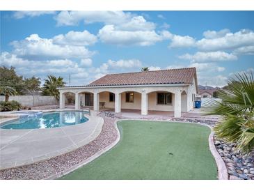 Home with pool, putting green, and covered patio at 1420 Ellen Tracy Way, Henderson, NV 89014