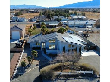 Solar-paneled home with spacious yard, long driveway, and mountain views at 1761 Augusta St, Pahrump, NV 89048