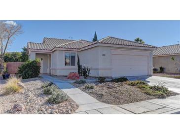 One-story house with a landscaped front yard and attached two-car garage at 2693 Hollowvale Ln, Henderson, NV 89052