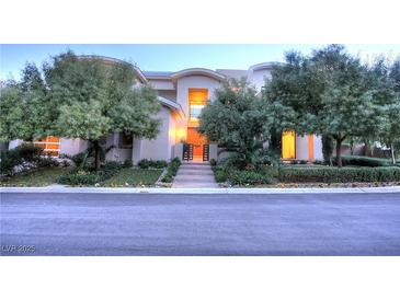 Modern two-story home with landscaped front yard and gated entry at 7521 Yonie Ct, Las Vegas, NV 89117