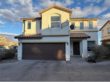 Two-story house with brown garage door and neutral color exterior at 8237 New Leaf Ave, Las Vegas, NV 89131