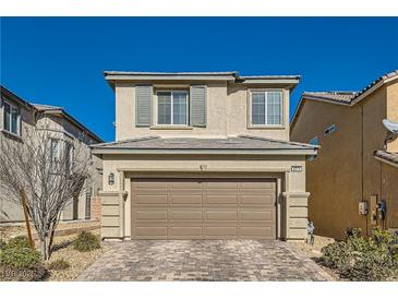 Two-story house with a two-car garage and a landscaped front yard at 8272 Southern Cross Ave, Las Vegas, NV 89131