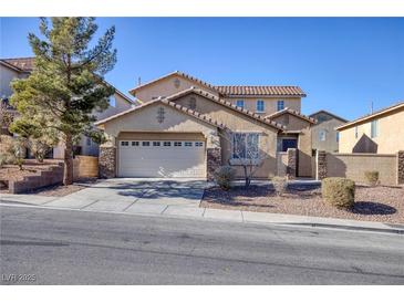 Two-story house with stone accents and a two-car garage at 185 Rocky Star St, Henderson, NV 89012