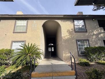 Exterior view of the apartment building showing the entrance and landscaping at 2606 S Durango Dr # 171, Las Vegas, NV 89117