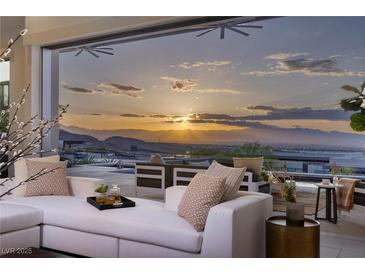 Outdoor patio featuring stylish seating with stunning sunset views overlooking the mountains and city at 1 Boulderback Dr, Henderson, NV 89012