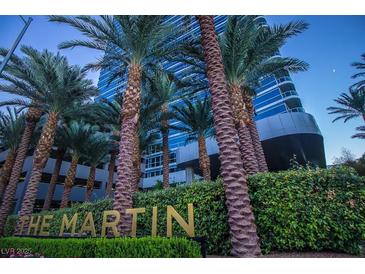 The Martin Condos: Modern highrise building with palm trees and lush landscaping at 4471 Dean Martin Dr # 507, Las Vegas, NV 89103