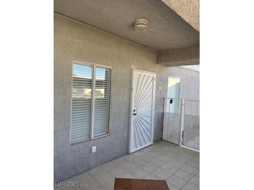 Inviting entryway with tiled flooring and a security door at 1726 N Jones Blvd, Las Vegas, NV 89108