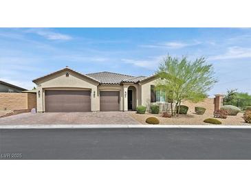 Single-story house with two-car garage, landscaping, and a neutral color scheme at 6160 Lautman Ridge Ct, Las Vegas, NV 89141
