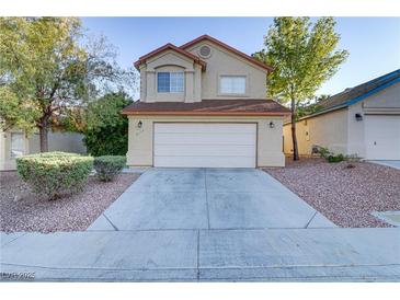 Two-story house with attached garage and landscaping at 8113 Bay Springs Dr, Las Vegas, NV 89128