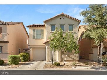 Two-story house with beige siding, a two-car garage, and landscaping at 104 Masserta Ct, Las Vegas, NV 89183