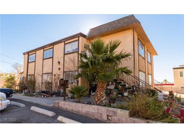 Tan two-story building with palm trees and landscaping at 523 Fir St, Boulder City, NV 89005