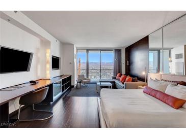 Modern bedroom with city views and comfortable bed at 4381 W Flamingo Rd # 3309, Las Vegas, NV 89103