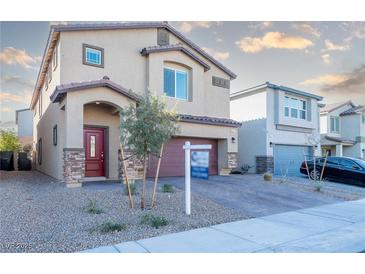 Two-story house with attached garage and landscaped front yard at 487 Via Renata, Henderson, NV 89044