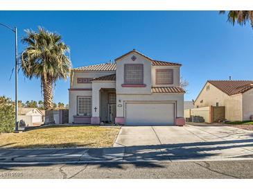 Two-story house with a large driveway and landscaped lawn at 526 Feliz Contado Ct, Henderson, NV 89015