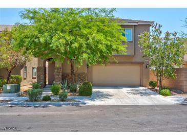 Two-story house with attached garage and landscaping at 7906 Woolly St, Las Vegas, NV 89149