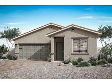 Single-story home with two-car garage and desert landscaping at 2733 Avril Point St, Las Vegas, NV 89156