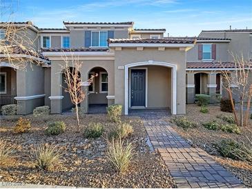 Two-story home with attractive landscaping and a paved walkway at 3206 Brynley Ave, Henderson, NV 89044