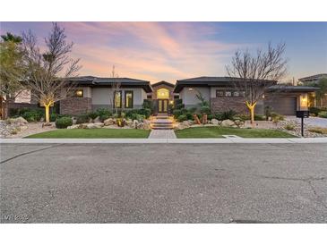 Stunning modern home with stone accents and landscaped grounds at 8075 Palm Cove Ct, Las Vegas, NV 89129