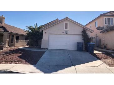 Single-story house with a two-car garage and a landscaped front yard at 8333 Fame Ave, Las Vegas, NV 89147