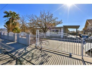 Updated single story home with new paint and landscaping at 1605 Oakwood Ave, North Las Vegas, NV 89030