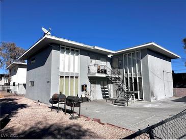 Two-story building with parking and fenced yard at 3370 Athens St, Las Vegas, NV 89169