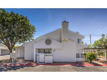 Charming home featuring neutral stucco, chimney, front door, and lovely surrounding trees at 5655 Vineyard Ln # 0, Las Vegas, NV 89110