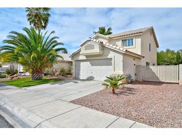 Charming two-story home featuring stucco siding, desert landscaping, and a two-car garage at 6113 Breeders Cup St, Las Vegas, NV 89130