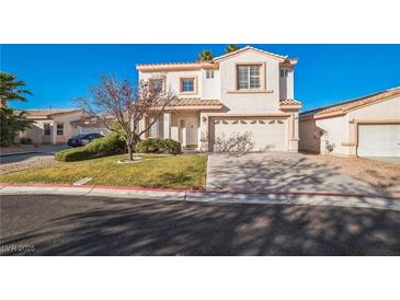 Two-story house with attached garage and landscaped front yard at 7809 Smokerise Ct, Las Vegas, NV 89131