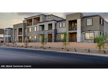 Modern townhome community with attractive landscaping and private balconies at 135 Harmonica Ave # Lot 18, Henderson, NV 89011