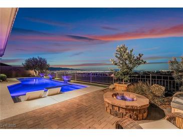 Stunning backyard oasis with a pool, fire pit, and city views at 2837 Josephine Dr, Henderson, NV 89044