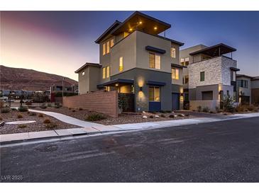 Modern three-story home with a sleek design and city views at 6289 Redstone Hills Dr, Las Vegas, NV 89148