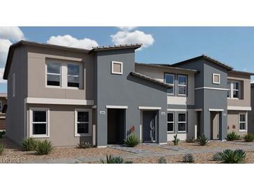 Contemporary tri-level townhome with two-car garage and desert landscaping at , North Las Vegas, NV 89084