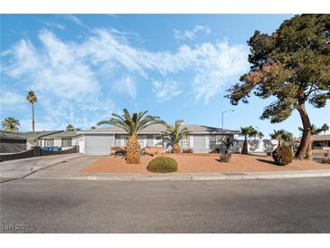 Ranch style home with landscaped yard and curb appeal at 4818 El Tesoro Ave, Las Vegas, NV 89121