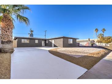 Newly renovated single story home with modern facade and landscaped yard at 104 Temple Dr, Las Vegas, NV 89107