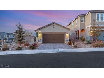 Two-story home with a brown garage door and landscaped yard at 3484 Bradano Ln, Henderson, NV 89044