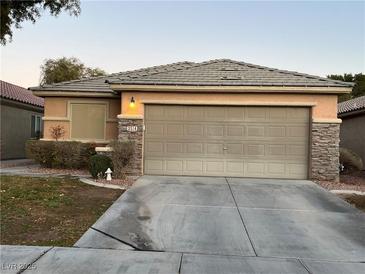 One-story house with attached garage and landscaping at 3514 Old Course St, Las Vegas, NV 89122