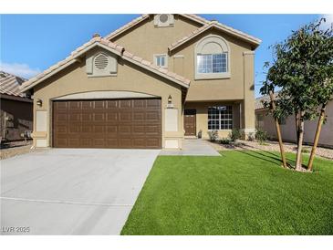 Two-story house with brown garage door and artificial turf at 5912 Royal Castle Ln, Las Vegas, NV 89130