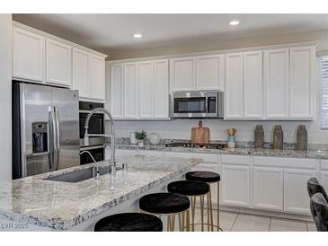 Modern kitchen with stainless steel appliances and granite countertops at 712 Rogue Wave St, Las Vegas, NV 89138