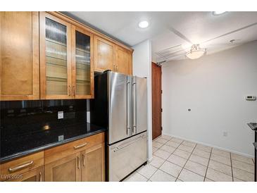 Modern kitchen with stainless steel appliances and wood cabinets at 8255 S Las Vegas Bl Blvd # 718, Las Vegas, NV 89123