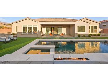 Luxury home with a sparkling pool, spacious patio, and fire pit at 8535 Black Brush Ln, Las Vegas, NV 89131