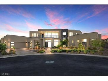 Luxury modern home with expansive windows and landscaped front yard at 9780 Solar Ave, Las Vegas, NV 89149