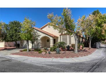 Single-story house with desert landscaping and a two-car garage at 4420 Resthaven Cir, North Las Vegas, NV 89032