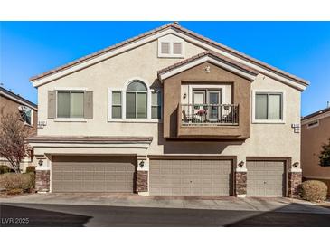 Two-story townhome with attached two-car garage and private balcony at 9132 Forest Willow Ave # 102, Las Vegas, NV 89149