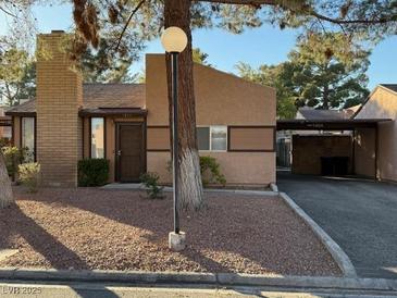 Attractive single-story home with carport and landscaping at 1804 Discus Dr, Las Vegas, NV 89108