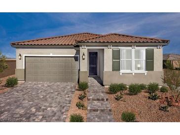 One-story home with tile roof, attached garage, and landscaped front yard at 732 Icy Fjord Ln, Henderson, NV 89015