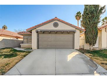 Single-story house with attached garage and landscaped front yard at 759 Whispering Palms Dr, Las Vegas, NV 89123