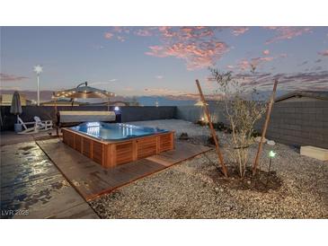 Relax in your own backyard spa with wooden deck at 9465 White Fir Grove Ct, Las Vegas, NV 89143