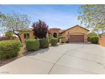 Single-story house with landscaped front yard, driveway, and attached garage at 10372 Hawks Wing St, Las Vegas, NV 89178
